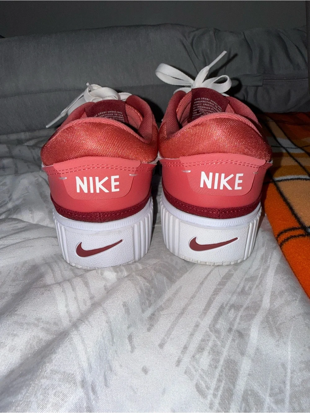Nike Women’s Rose Pink Suede Sneakers with White Swoosh